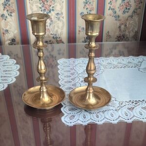 A Pair Of Brass Candle Sticks
